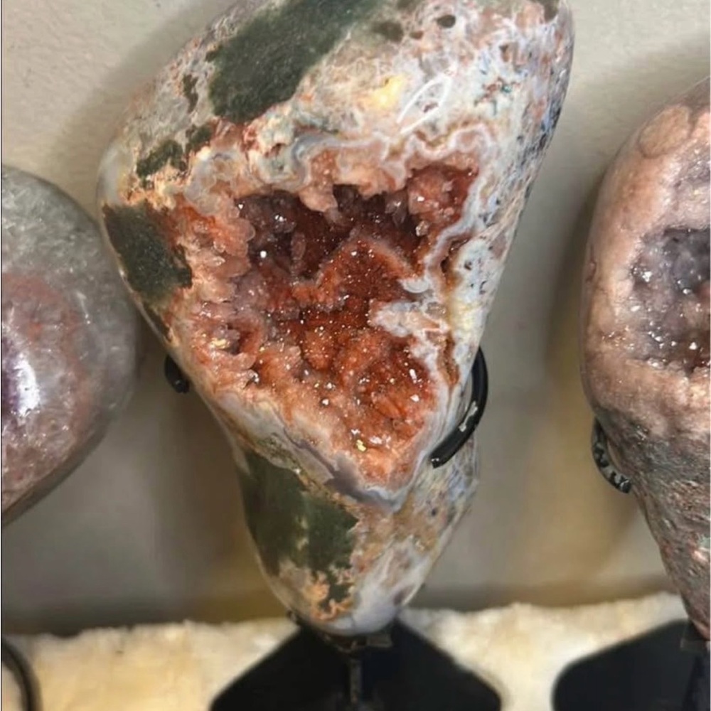 Druzy pink amethyst statement piece on stand.